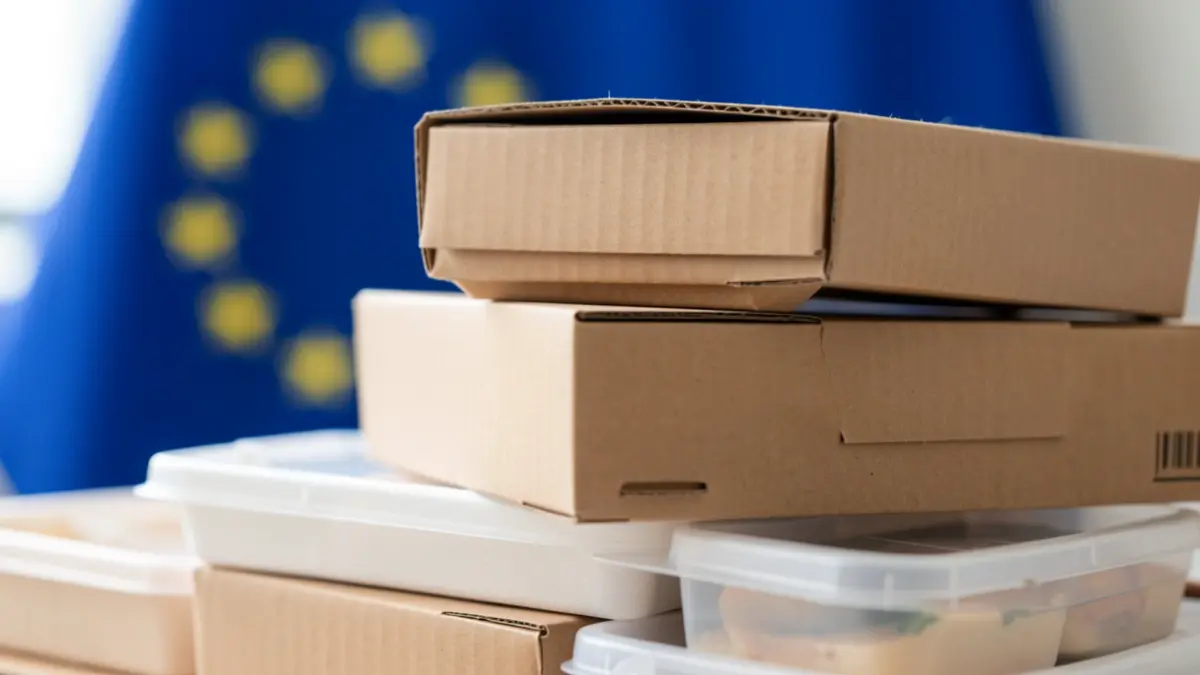 Generic image of food packaging with European Union flag in the background.